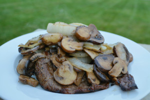 Perfect grilled steak with mushrooms and onions